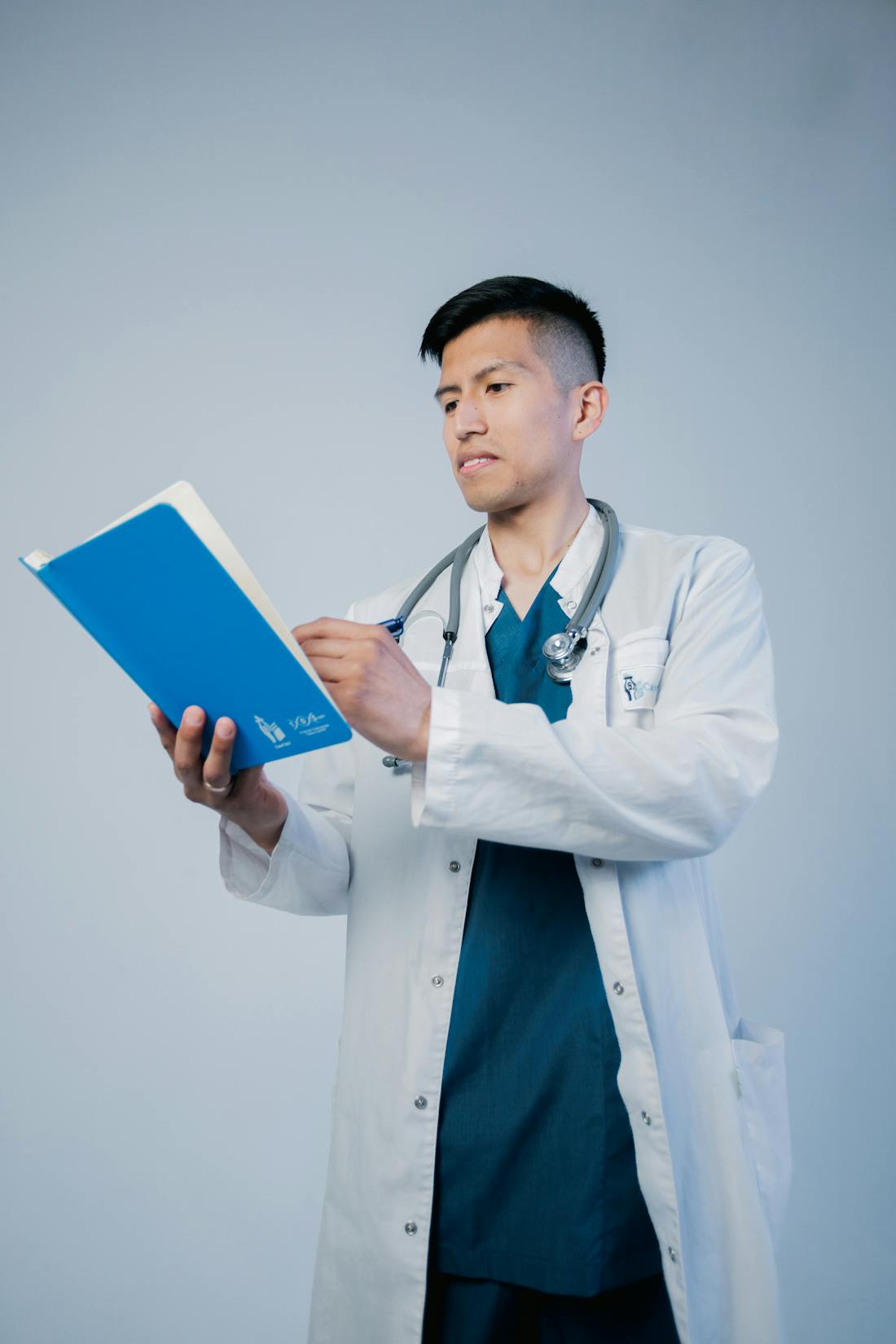 Doctor reviewing a blue medical file